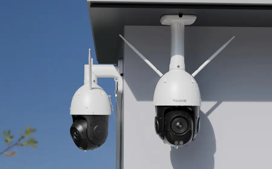 Two pan-tilt cameras mounted under an eave