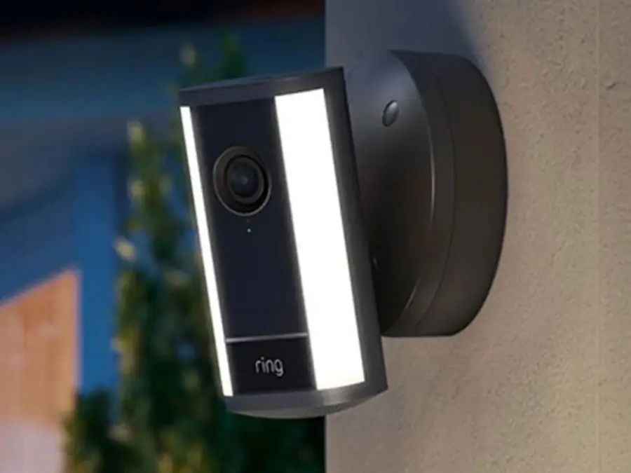 Ring spotlight camera mounted on a wall